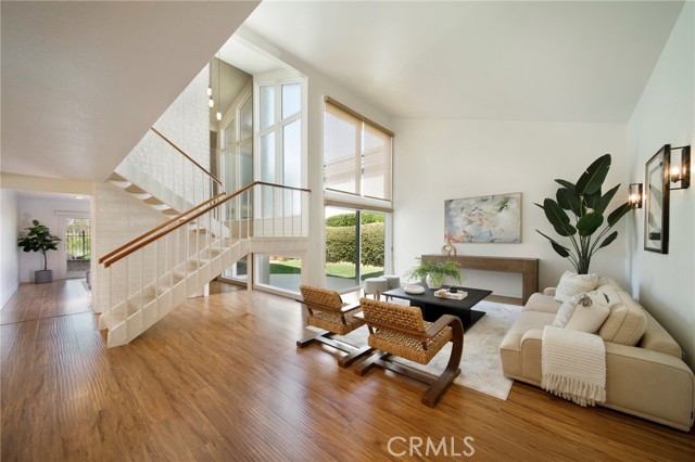 129 The Masters Circle Costa Mesa, California With sweeping views of Santa Ana Country Club Golf Course, this renewed 3 bedroom and 3 bathroom home leaves little to be desired. From its chef’s kitchen, including Viking range, commercial hood & double ovens, to the beautifully landscaped yard overlooking the 11th hole, one will be sure to feel a sense of utility & serenity. Improvements made include new paint, new carpet, new light fixtures, double-paned windows, central A/C and much more. The first floor encompasses formal living and dining rooms, kitchen, a family room with gas fireplace, a guest room and full bathroom. The second floor is complete with another guest room, full bathroom, office space with a gas fireplace and a luxurious primary suite. This retreat is comprised of a large picture-window overlooking the golf course, walk-in closet with new custom built-ins, vanity area, dual sinks and a large walk-in shower. The oversized, two-car garage has been upgraded with a epoxy floor and new garage door that complete the space. The location cannot be beat with quick access to the 55, 73, and 405 freeways, close proximity to South Coast Plaza, the beach and John Wayne Airport.