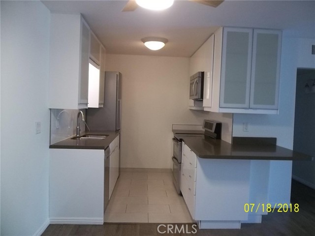 564 N Bellflower Boulevard 319 Long Beach, California Resort style living in this remodeled 1 Bedroom, 1 Bath single level condo is a corner unit on the top floor with views of the garden and pond. Open
the bedroom and living room new sliding doors to your private balcony with the garden view.This tastefully remodeled home features new paint,
new engineered wood floor throughout the home with cork underneath. The new kitchen features white top of the line Ikea cabinets, with quartz
countertop, wrap-around breakfast bar, and added cabinets on top. New appliances include a tall Bosch refrigerator with bottom freezer, a double
oven, microwave and dishwasher. One of the hallway closets is turned into office space with shelves and cabinets on top. the spacious bathroom is
completely remodeled with new tiles, tub, vanity, and fixtures. This unit has a new water heater, and a walking closet in the spacious bedroom,
elevator access to third floor and an assigned covered parking in a gated lot. Located in the gated community of Stoneybrook villas this home offers
outstanding amenities with a gym, multiple pools, spa, sauna, tennis courts, BBQs, club house with a full size bar and library perfect for CSULB
students, first time home buyers and business professionals. Centrally located close to FWYs (605, 405, 22), shopping, restaurants, marine, beach,
stadium, Colorado Lagoon, Naples, 2nd, and Belmont shore.