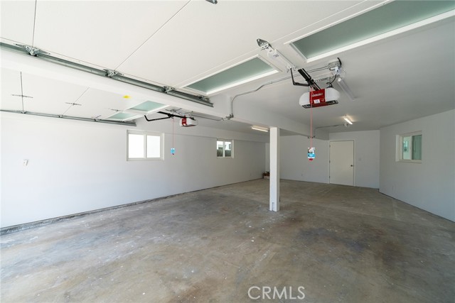 Four car garage with entrance to the home