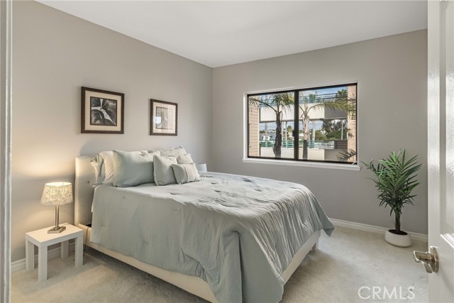 Guest bedroom with a luxurious and bright coastal feel