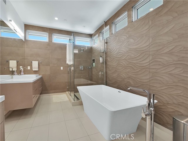 Master bath with floor to ceiling luxurious Porcelanosa tiles.