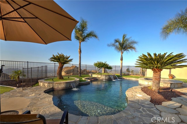 View of pebble tec pool and spa