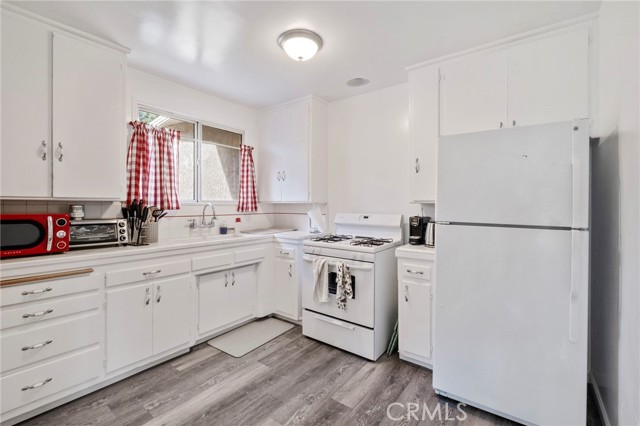 Plenty of Room to Walk Around in this Cute Kitchen.