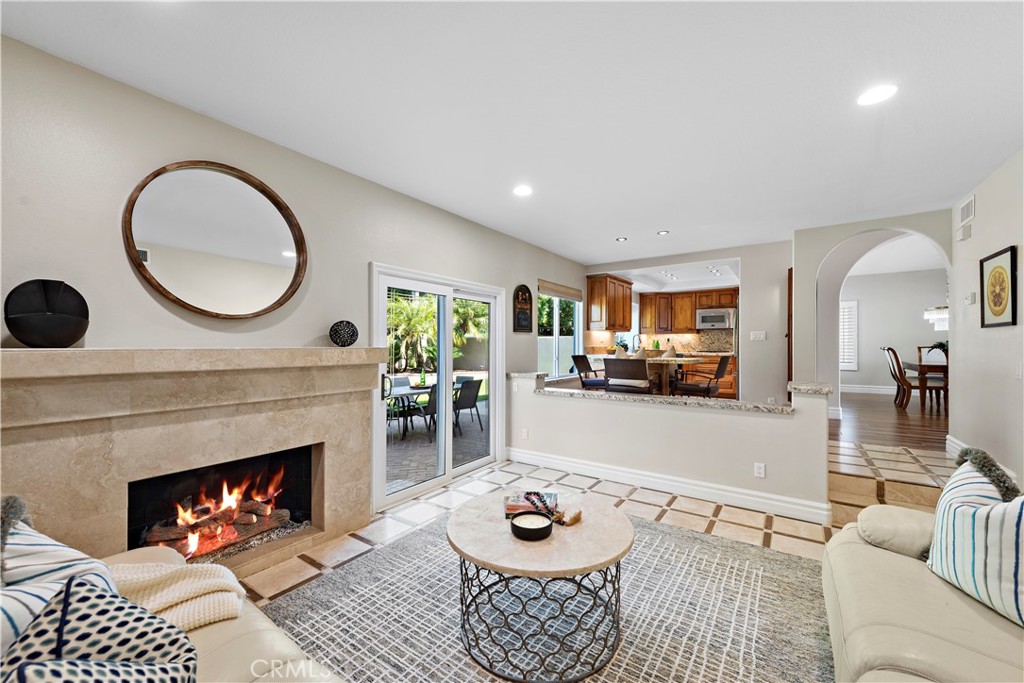 Introducing 3 Trestles, an exceptional residence tucked within the highly desirable community of "The Palisades" in Laguna Heights. Renowned for its generous lots, low HOA dues, expansive streets, and top-tier schools, this neighborhood embodies the essence of California living. Immaculately maintained, the home resides on a supremely private lot adorned with many mature trees, creating an idyllic retreat within its spacious backyard, perfect for a future pool. Every detail of this residence exudes a sense of meticulous care and attention. As you step inside, you are embraced by the warmth of natural light illuminating the vaulted ceilings. The airy living room seamlessly transitions into an elegant formal dining area. The first-floor features a combination of ceramic wood tile and natural stone flooring, showcasing an optimal blend of style and durability. Artistic archways and meticulously crafted custom cabinetry adorn key areas of the home, highlighting a sophisticated design. The kitchen boasts leathered natural stone countertops and backsplash, double ovens, a gas burner cooktop, Mieli dishwasher, and refrigerator. A cozy breakfast nook beckons for morning gatherings, while the adjacent step-down family room, adorned with a stone-faced gas fireplace, provides access to the backyard. Ascending upstairs, discover two well-appointed secondary bedrooms with custom organized closets and spacious guest bathroom. The primary suite, generously proportioned, presents "his and her" walk-in closets and an en-suite bathroom adorned with a dual sink vanity, stone slab countertops, a soaking tub, and a sizeable walk-in shower also featuring slab stone surfaces. Notable enhancements include a whole house re-pipe, new AC, furnace, and water heater, dual pane energy-efficient windows & slider, rear patio with retractable awning + heater and wood shutters adding a touch of elegance. An inside laundry room and a 3-car garage, round out this exemplary residence. Introducing 3 Trestles, an exceptional residence tucked within the highly desirable community of "The Palisades" in Laguna Heights. Renowned for its generous lots, low HOA dues, expansive streets, and top-tier schools, this neighborhood embodies the essence of California living. Immaculately maintained, the home resides on a supremely private lot adorned with many mature trees, creating an idyllic retreat within its spacious backyard, perfect for a future pool. Every detail of this residence exudes a sense of meticulous care and attention. As you step inside, you are embraced by the warmth of natural light illuminating the vaulted ceilings. The airy living room seamlessly transitions into an elegant formal dining area. The first-floor features a combination of ceramic wood tile and natural stone flooring, showcasing an optimal blend of style and durability. Artistic archways and meticulously crafted custom cabinetry adorn key areas of the home, highlighting a sophisticated design. The kitchen boasts leathered natural stone countertops and backsplash, double ovens, a gas burner cooktop, Mieli dishwasher, and refrigerator. A cozy breakfast nook beckons for morning gatherings, while the adjacent step-down family room, adorned with a stone-faced gas fireplace, provides access to the backyard. Ascending upstairs, discover two well-appointed secondary bedrooms with custom organized closets and spacious guest bathroom. The primary suite, generously proportioned, presents "his and her" walk-in closets and an en-suite bathroom adorned with a dual sink vanity, stone slab countertops, a soaking tub, and a sizeable walk-in shower also featuring slab stone surfaces. Notable enhancements include a whole house re-pipe, new AC, furnace, and water heater, dual pane energy-efficient windows & slider, rear patio with retractable awning + heater and wood shutters adding a touch of elegance. An inside laundry room and a 3-car garage, round out this exemplary residence.