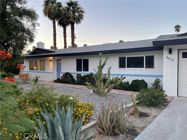 2212 PASEO ROSETA Palm Springs, California Welcome to this California modern Palm Springs pool home in the highly sought after area of Sunrise Park! Fully renovated, this entertainer's dream has been completely reimagined, inside and out. Upon walking in you will not only notice the fresh color scheme with an accented fireplace, but your eyes will immediately land on the waterfall quartz countertops directly below the focal point of an oversized natural finish wood beam. The open concept living space features three large bedrooms of which the master suite has a walk-in closet, as well as a separate sitting area with access to the backyard. Stylish finishes throughout the property make this home look and feel contemporary. Once you step outside into the massive sanctuary of a backyard, you will be ready to relax poolside in the afternoon sun and then soak in the hot tub in the evenings. Whilst in the compound, one cannot help but get the impression of full privacy with mature flora, separate sitting areas including a new pergola, and still a large enough area for a full sized volleyball court! If all of that was not enough, you are less than 1.5 miles from downtown! Do not hesitate as this one surely will not last.