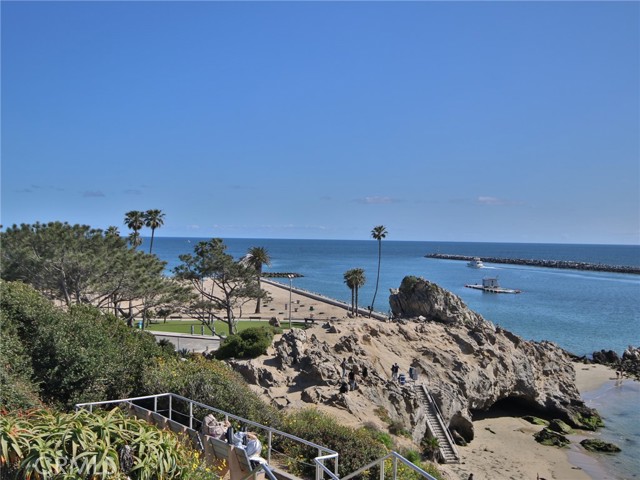 The beach is next to the entry to Newport Harbor.