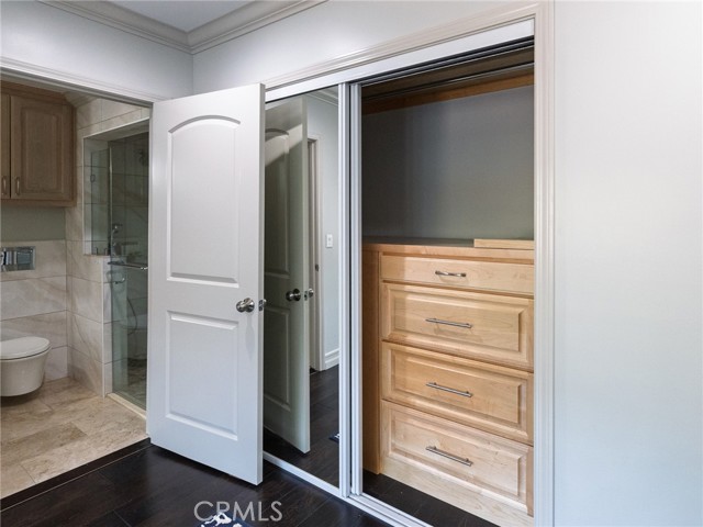 Closet System inside each Mirrored Closet