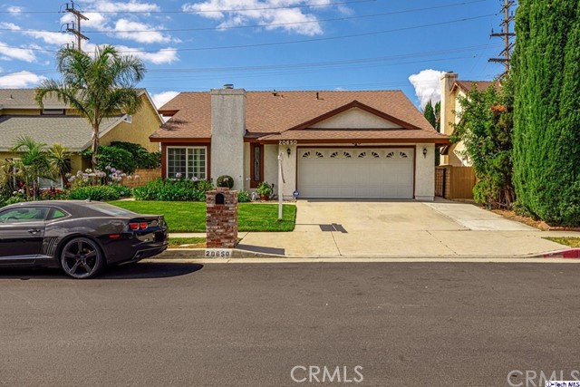 20650 Lemmer Street Chatsworth, California Residing on a sun washed street in Chatsworth, this 3-bedroom, 2-bathroom, 1,658-sqft home with attached 2-car garage is ready to be leased to you! Neat greenery along the walkway lead you inside to first find a bright living room highlighted by high ceilings, large corner French windows complete with shutters, a decorative fireplace, baseboard moldings, and honey colored laminate floors throughout. Through a crisp dining room, the open kitchen includes recessed lights, all stainless-steel appliances, ample cabinet storage, granite counters with breakfast bar, plus an additional dining space with sliding glass door access to the backyard. Each bedroom includes center ceiling fans and built-in storage while the primary bedroom is enhanced with an en-suite split bath that includes dual sinks with a granite countertop. Outside in the backyard is a comfortable open patio space, delightful grassy space, and raised flower beds, allowing for peaceful contemplation and relaxation. Nearby Stoney Point High School, Starbucks, Vons, Trader Joe's, popular dinning, Porter Ranch Town Center, The Vineyards at Porter Ranch, Northridge Fashion Center, and much more!