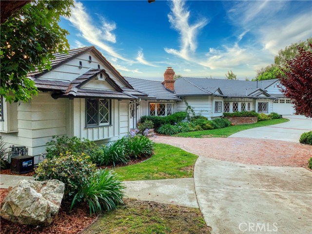 Welcome to this gorgeous California Ranch home with amazing features! Right from the start a graceous circular driveway and motor court allows for plenty of guest parking.