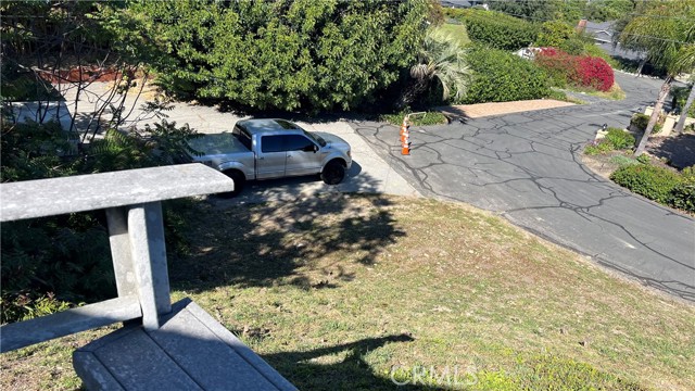 Showing sellers\' silver truck parked on his property, not the neighbors property.