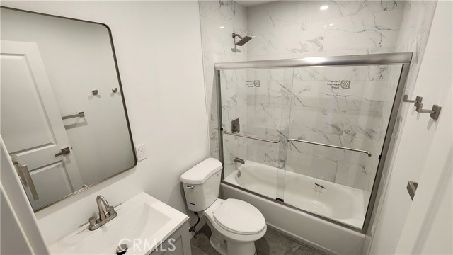BA1 downstairs. Nickel fixtures, glass shower door