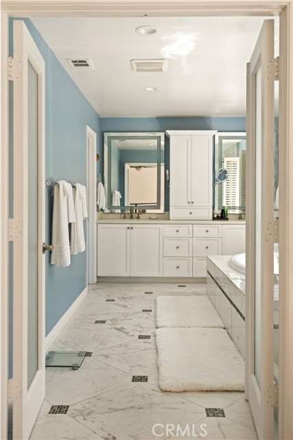 double door entry to primary bathroom