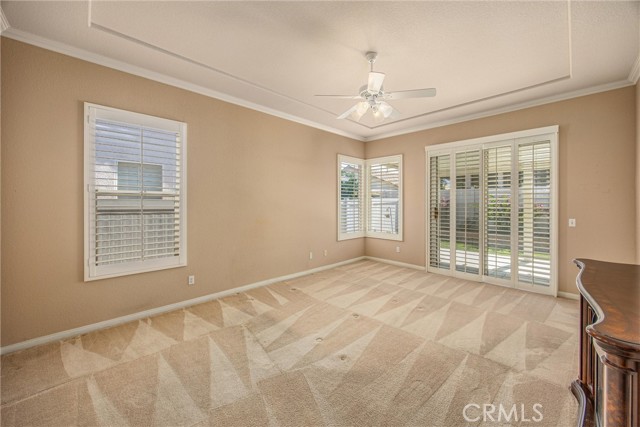 Primary Bedroom has sliding door to the backyard & patio.