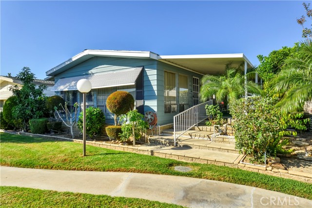 Living room faces the lush greenbelt.