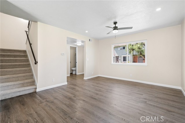 Entering the home, you are greeted by a bright and spacious family room with laminate floors and a new dual paned window!