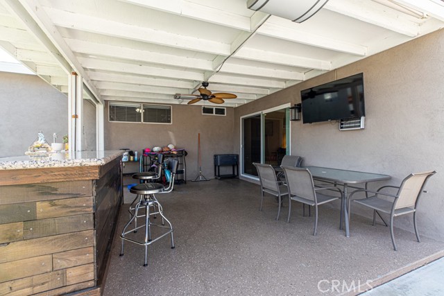 Backyard patio with outdoor bar - daytime