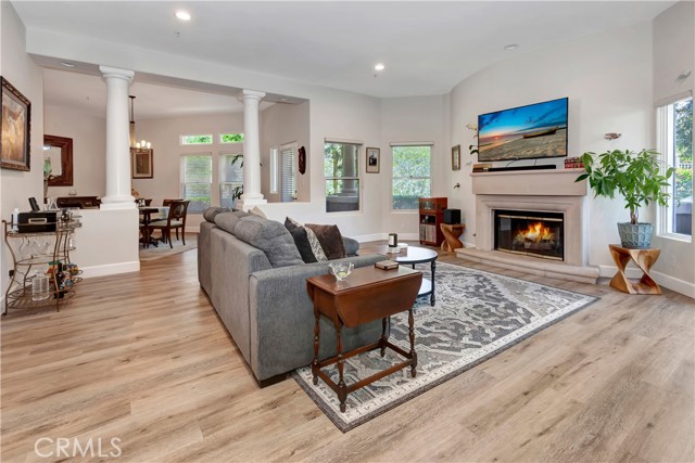 Living room and dining room with view of greenbelt