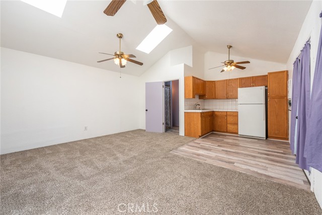 Back house living room facing kitchen and bathroom