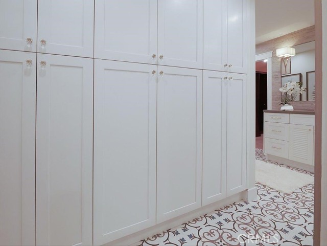 Plenty of built-in linen/storage cabinets in master bathroom