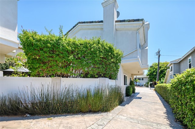 View of Backyard Vinyl Fencing - driveway side.