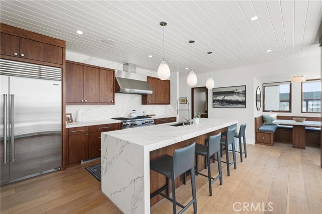 Kitchen, top-of-the line-stainless steel appliances, T and G ceilings, wide plank, Riffed cut White Oak flooring.