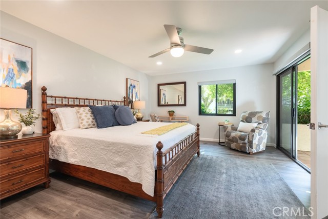 The light and bright bedroom also leads out to the main patio. New ceiling fan and recessed lighting.