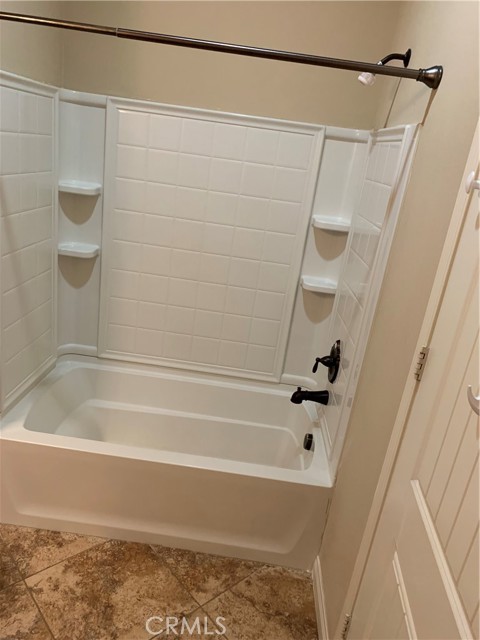 bathroom tub and shower in hall