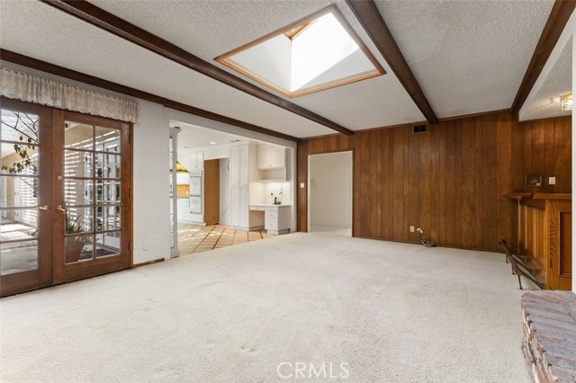 Skylight, French doors open to the patio with pergola.