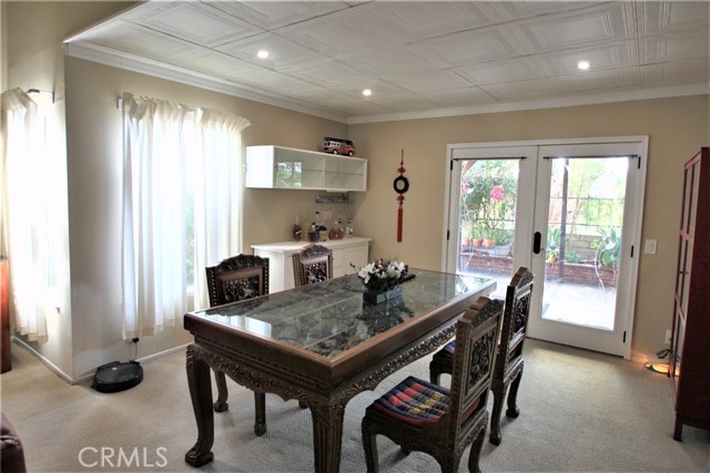 another view of Formal Dining area- recessed lights, bright & open, French door leading to Back Yard.