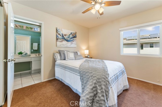 One out of four bedrooms that is set off from a shared full bath. Double pane window, ceiling fan and low pile carpet.