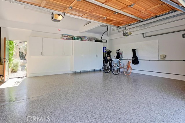 Over-sized 3 car garage with built-in organization.