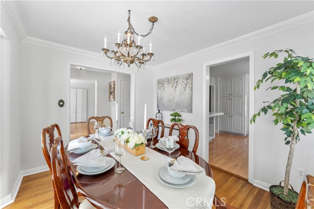 Imagine the conversations around the formal dining table. Throughway in the distance (left of image) leads to entry and another throwaway to the formal dining. Througway to the right of image leads to the kitchen.