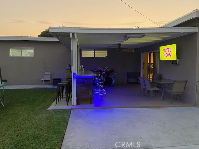 Backyard patio with outdoor bar - evening