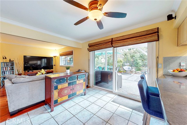 Second optional dining area with ceiling fan and glass sliding doors leading to the backyard.