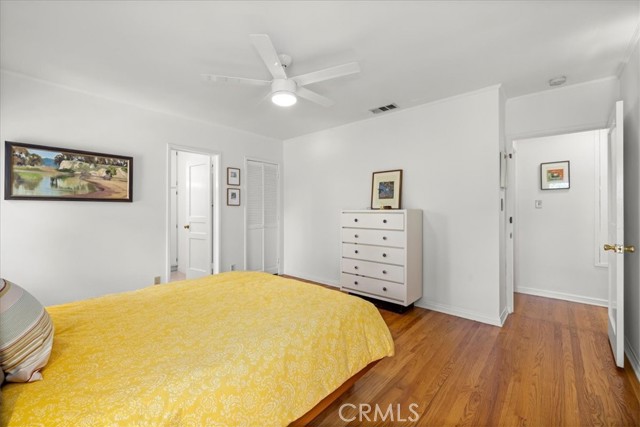 Walk-in style closet in corner