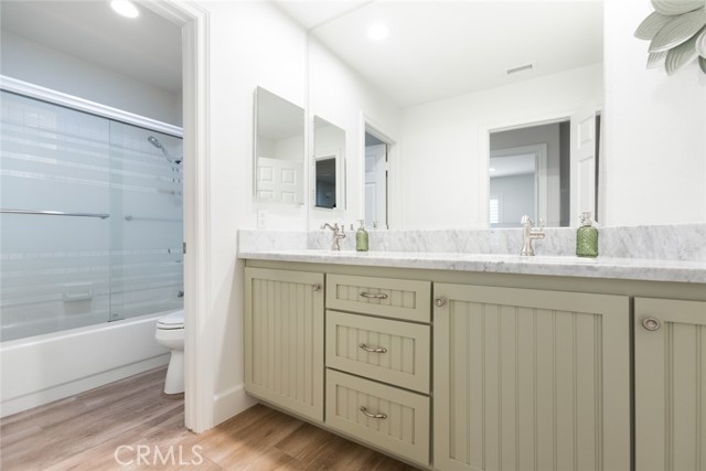 There is door to separate the shower/tub, toilet area. Which works perfectly if multiple people are getting ready at the same time.