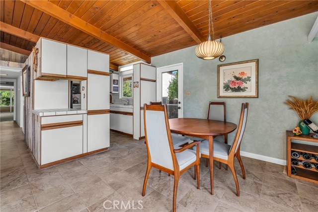 View of the hall leading to the back of the house,  kitchen, dining area