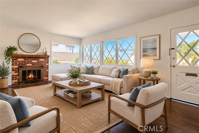 The Living Room Is Open, Bright and Flooded with Light from the Surrounding Windows. Virtually Staged