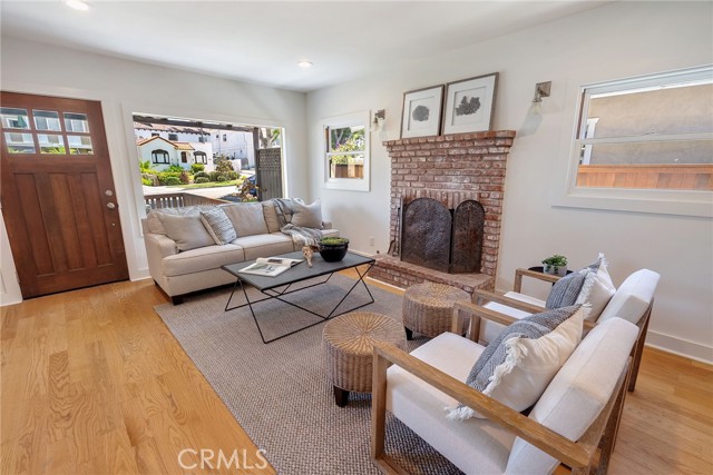 Living Room with wood burning fireplace and gas starter.