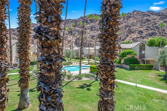 Views of pool and mountains from balcony