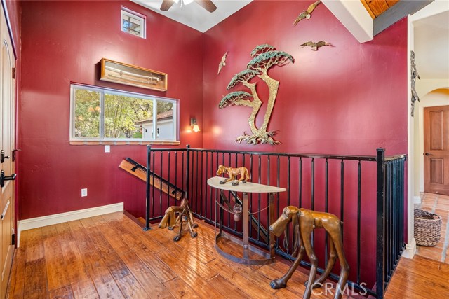 You are greeted by engineered hardwood floors and vaulted ceilings.  The stairs lead to the family room, we'll see it later.