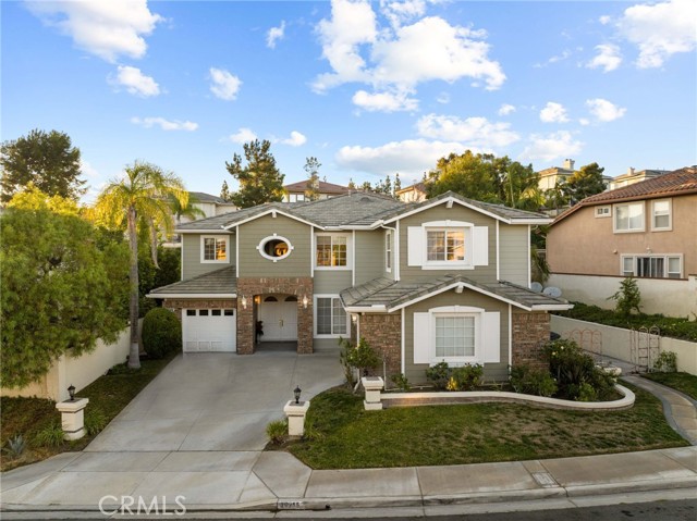 Discover the epitome of luxurious living at 20215 Landig Circle, a freshly painted, expansive 3,700+ square foot
residence nestled in the prestigious and highly sought-after East Lake Village of Yorba Linda. With soaring
ceilings, sun-drenched spaces, an array of thoughtful amenities, and multiple living areas, this 4-bedroom,
4.5-bathroom home is a haven of tranquility and sophistication in the heart of Yorba Linda luxury.
As you enter, be greeted by the grandeur of high ceilings and freshly painted walls that accentuate the open floor
plan, allowing natural light to cascade through every corner. Multiple living spaces await, including a formal
living room with a cozy fireplace, elegant dining room ideal for hosting, inviting family room perfect for movie
nights, and a dedicated office, ensuring that every member of the household finds their perfect space for
relaxation or productivity.
The heart of the home is the gourmet kitchen, complete with gleaming granite countertops, ample cabinetry, a
large center island, and a spacious layout that inspires culinary creativity. Adjacent to the kitchen, you'll find
both a casual breakfast nook with backyard views and a formal dining room, perfect for hosting intimate dinners
or grand celebrations.
Each of the four bedrooms is a private retreat, featuring its own en suite bathroom for ultimate convenience and
privacy. The luxurious master suite boasts a private balcony overlooking the tranquil backyard, while the spa-like
ensuite bathroom offers a soaking tub, dual vanities, and a walk-in shower, a true oasis to unwind after a long
day. A guest bedroom with its own bathroom is conveniently located downstairs, providing a comfortable haven
for visiting friends and family.
Step outside to your own private haven, where a cozy backyard awaits, perfect for intimate gatherings and
entertaining. The expansive patio offers an ideal setting for al fresco dining or simply lounging with a good book.
The meticulously landscaped grounds create a serene backdrop for your everyday enjoyment.
20215 Landig Circle is more than just a house; it's a lifestyle. Don't miss this rare opportunity to own a piece of
paradise in the highly coveted community of Yorba Linda. Schedule a showing today and let this exceptional
residence redefine your vision of luxury living in Yorba Linda.