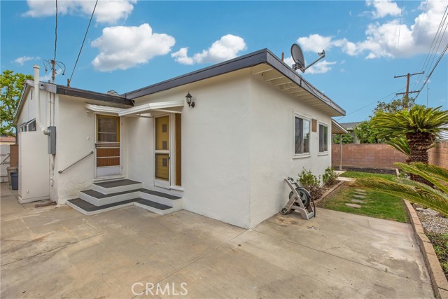 Otherside of the house, two doors, one from laundry room and one from the Bar area