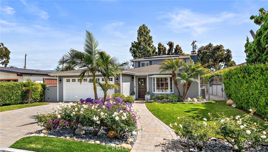 Impeccably maintained, professionally upgraded, and enviably nestled on one of the best streets in the Palisades neighborhood of Dana Point’s Capistrano Beach, this move-in-ready home is destined to enrich your lifestyle. Curb appeal draws attention to the residence, which features a well-manicured front yard with colorful professional landscaping and a driveway and pathway finished with pavers. The two-story home, which spans approximately 2,272 square feet, showcases true pride in ownership, with top-quality finishes and fixtures enriching every room. Upon entry, the living and dining rooms unite in one large space and feature a bay window with custom built-in seat, a stone fireplace, and a large skylight. This area flows seamlessly into a remodeled kitchen with breakfast nook, laundry closet, patio access, a peninsula bar, granite countertops with full backsplash, white cabinetry with glass uppers, a garden window above the sink, a pantry, and stainless steel appliances from Bosch, Dacor, and GE Profile, including a five-burner cooktop. Three bedrooms and two remodeled full baths are featured downstairs, with an ensuite bedroom allowing direct access to the outdoor patio. Upstairs, a light and airy loft leads to a primary suite with walk-in closet, remodeled bath with two sinks and large walk-in shower, and private deck. The loft, primary suite, and deck offer peeks at the ocean. Further enhancements include an attached two-car garage with SparTek flooring, solar power, marble bath finishes, hardwood flooring throughout, fresh interior and exterior paint, professional landscaping, custom lighting, water filtration system, and Ring security system with four cameras and a doorbell. Nearly 6,300 square feet, the property has a spacious backyard with paver-finished patio, gas fire pit, lifelike turf, after-beach shower, and a detached casita with custom floor-to-ceiling wall mirror, making it perfect as a gym or office. Desired for its tranquil ambiance and lightly traversed streets, Capistrano Beach’s Palisades enclave places residents within an easy stroll or bike ride from miles of beaches, Pines Park, a popular Sprouts Farmers Market, shopping and dining establishments, and excellent schools. Dana Point Harbor and the city’s lively Lantern District are minutes from home.