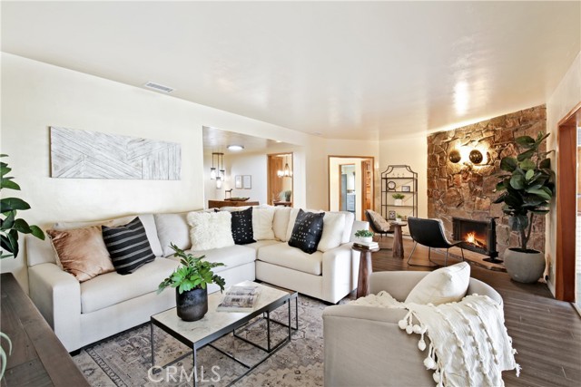 Formal living room with fireplace and new floors