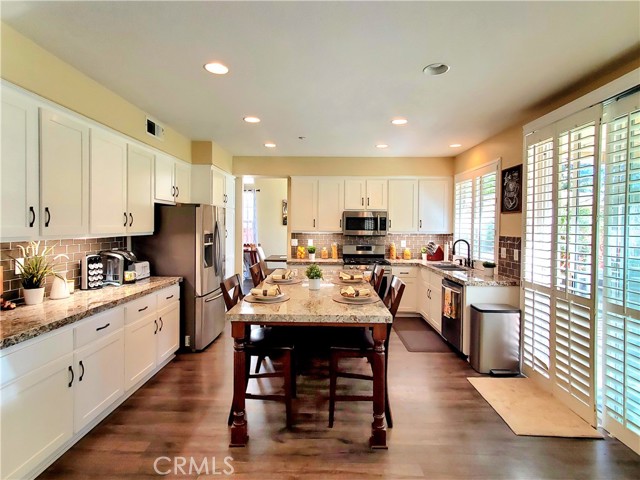 Kitchen view shows an abundance of storage and counter space