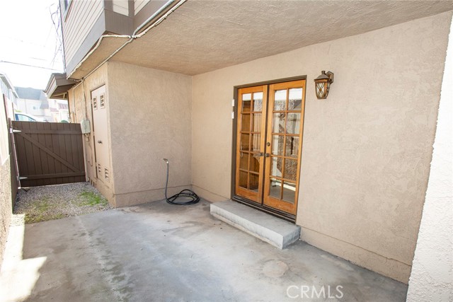 French Doors from Family Room to side enclosed patio.