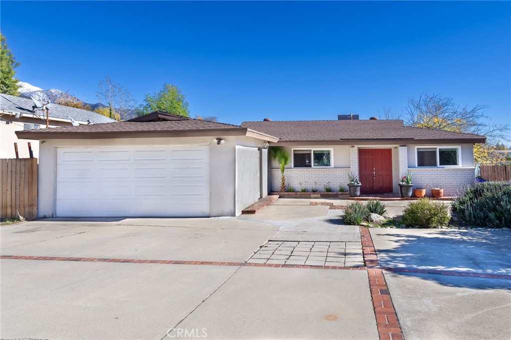 2456 Forman Street Upland, California A great opportunity to own a home in the highly desirable neighborhood of San Antonio Heights. This home features 3 bedrooms with 2 baths and an attached 2 car garage. RV potential parking in the front, with a very large backyard offering clear views of the snow-topped mountains. Upon entering the home you walk into the open floor plan of the living room, dining area, and kitchen. The dining area features a large sliding glass door offering plenty of natural light and views of the mountains. From the living room, you can enter the hallway to access the bedrooms and bathrooms. The Master bedroom features a large sliding glass door to the backyard to enjoy the views and the lush landscape, his and her closets, and an updated master bathroom. The two other bedrooms are large and feature mirrored closet doors. The backyard is split into two landscape styles. Closest to the home you have a cement patio perfect for entertaining while enjoying the views, manicured grass lawn with trees and bushes, and the back half of the yard features fruit and citrus trees to enjoy. This is a must see! (This home is on public water and does not need water shares.)