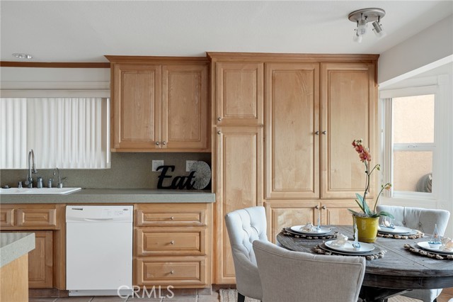 Kitchen with Pantry Cabinets and Dining Area