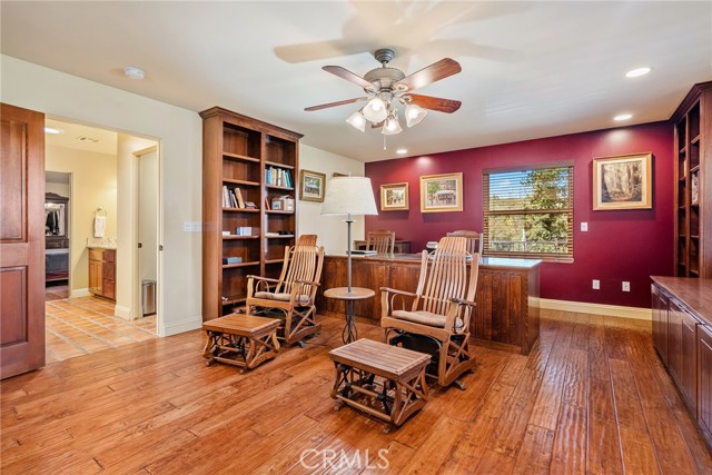 Connected to the primary suite is a custom office with its own private entry and large ~ 10.5 desk.  This room could also function as the third bedroom.